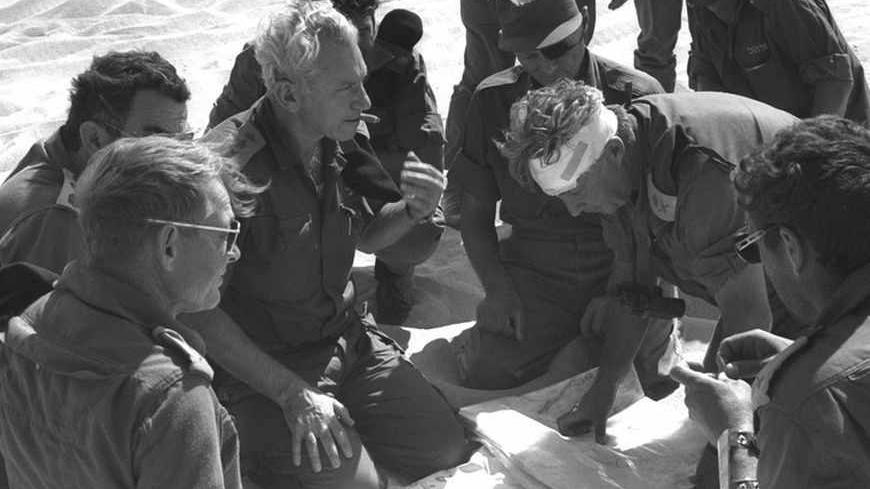 Israeli Major General in the Reserves Ariel Sharon (2nd R), Lieutenant General Haim Bar Lev (3rd L) and Israeli Defence Minister Moshe Dayan (C) confer October 17, 1973 during the 1973 Middle East War in this handout photo released by the Government Press Office. Surgeons battled to keep Sharon alive on January 5, 2006 after a massive brain haemorrhage felled the Israeli prime minister in the midst of his fight for re-election on a promise to end conflict with the Palestinians. ISRAEL OUT BW ONLY REUTERS/Go