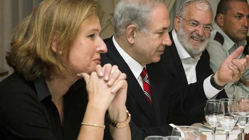 Israel's Prime Minister Benjamin Netanyahu (2nd L), flanked by Tzipi Livni (L), Israel's chief negotiator with the Palestinians, National Security Adviser Yaakov Amidror (3rd L) and Military Secretary Eyal Zamir, speaks with U.S. Secretary of State John Kerry (not pictured) during a meeting in Jerusalem June 29, 2013. Kerry extended his Middle East peace mission on Saturday, shuttling between Jerusalem and Amman for more talks with Israeli and Palestinian leaders on reviving their stalled negotiations. REUT
