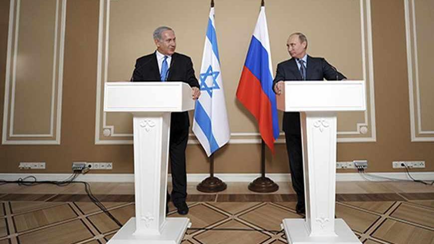 Israeli Prime Minister Benjamin Netanyahu (L) and Russian President Vladimir Putin attend a news conference at the Bocharov Ruchei state residence in the Black Sea resort of Sochi, May 14, 2013. Russian President Vladimir Putin said on Tuesday it was important to avoid actions that might aggravate Syria's civil war, a veiled warning against foreign military intervention or arming anti-government forces.  REUTERS/Alexei Druzhinin/RIA Novosti/Pool (RUSSIA - Tags: POLITICS) ATTENTION EDITORS - THIS IMAGE HAS B