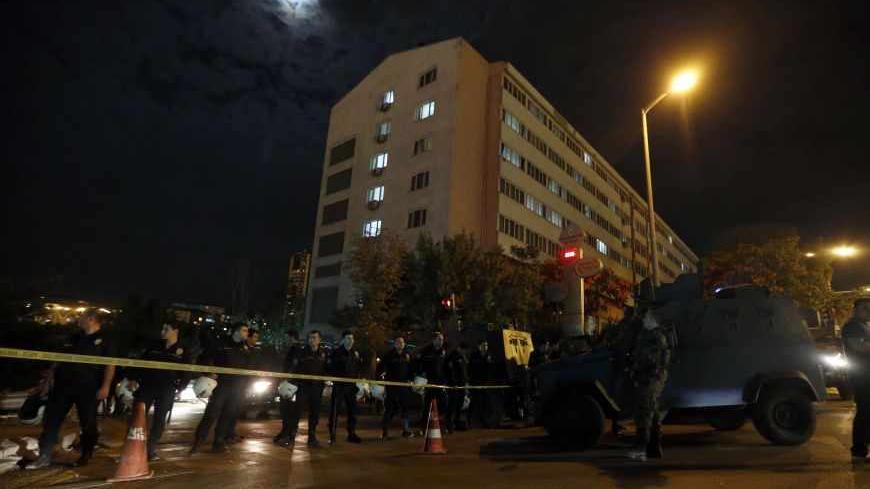 Policemen secure a police compound in Ankara September 20, 2013. The police compound was struck by three rockets on Friday, Interior Minister Muammer Guler said. Two buildings belonging to the national police directorate in the district of Dikmen were hit, but no one was hurt, Guler said. A third rocket fell into the grounds. REUTERS/Umit Bektas (TURKEY - Tags: POLITICS CRIME LAW) - RTX13STZ