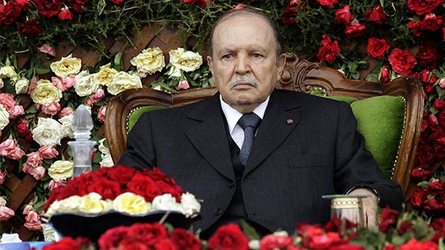 Algeria's President and  head of the Armed Forces Abdelaziz Bouteflika (L) attends a graduation ceremony of the 40th class of the trainees army officers at a Military Academy in Cherchell 90 km west of Algiers June 27, 2012. REUTERS/Ramzi Boudina(ALGERIA - Tags: POLITICS) - RTR348ML