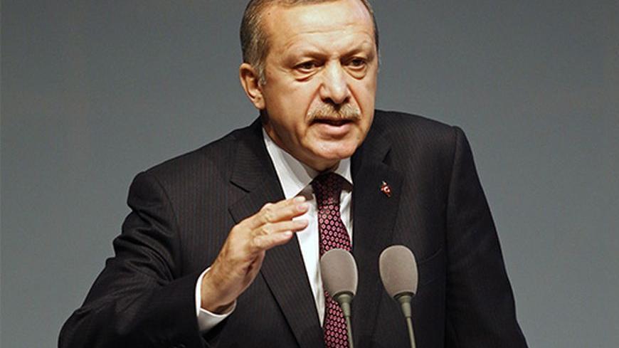 Turkey's Prime Minister Tayyip Erdogan address an audience during the European Bank for Reconstruction and Development's (EBRD) 2013 Annual Meeting and Business Forum in Istanbul May 10, 2013. Erdogan said Turkey would support a U.S.-enforced no-fly zone in Syria and warned that Damascus crossed President Barack Obama's "red line" on chemical weapons use long ago, according to an NBC News interview released Thursday. REUTERS/Osman Orsal (TURKEY - Tags: POLITICS BUSINESS) - RTXZH9Z