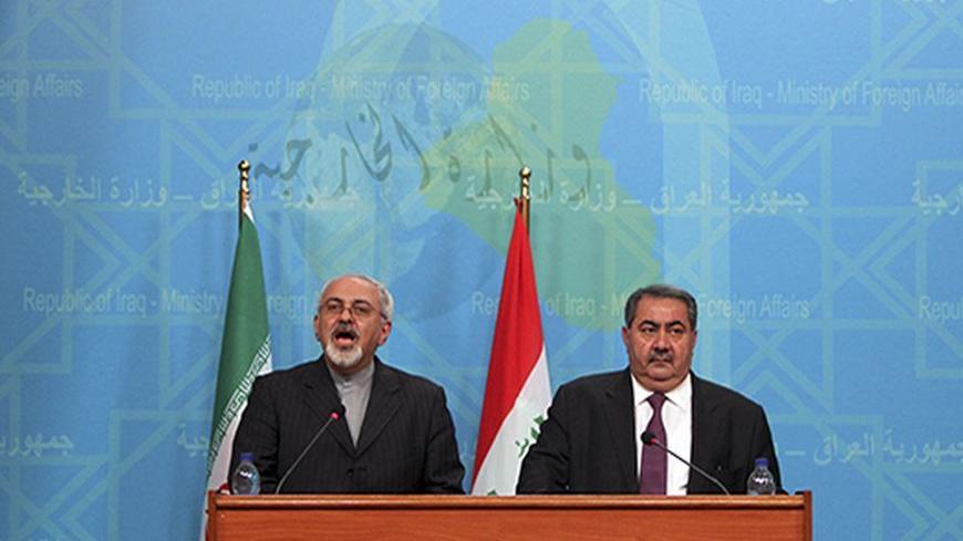 Iranian Foreign Minister Mohammad Javed Zarif (L) speaks during a joint news conference with his Iraqi counterpart Hoshyar Zebari in Baghdad, September 8, 2013. The United States will ignite a fire across the Middle East if it attacks Syria, Zarif said on a visit to Iraq on Sunday, warning Western powers against warmongering. REUTERS/Ahmad Al-Rubaye/Pool (IRAQ - Tags: POLITICS) - RTX13CU2