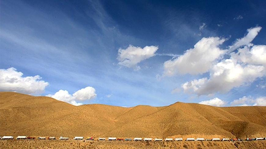 Hundreds of trucks bringing in diesel from Iran line up on a road as they head to the eastern province of Van in Turkey November 30, 2005. In the shadows of mountains bordering Iraq and Iran, Turkey's Hakkari province may one day be an outpost of the European Union. But for now, it feels cut off from the world. Picture taken November 30, 2005. To match feature Turkey-Southeast REUTERS/Fatih Saribas PP05120119 - RTR1AGKV