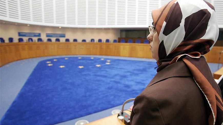 Strasbourg, FRANCE:  Former member of the Turkish Grand National Assembly and member of Turkish Fazilet Partisi (Virtue Party) Merve Safa Kavakci, waits for judges to come for a hearing at the European human rights court, 13 October 2005 in Strasbourg, on the merits in the case of Kavakci vs the state of Turkey, against the Turkish ban of her party. AFP PHOTO OLIVIER MORIN  (Photo credit should read OLIVIER MORIN/AFP/Getty Images)