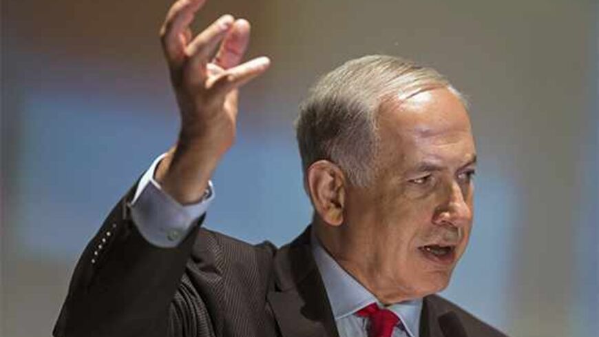 Israel's Prime Minister Benjamin Netanyahu speaks at a conference in Tel Aviv University October 29, 2013. A planned release of 26 Palestinian prisoners has provoked feuding within Israel's governing coalition, already under strain from U.S.-brokered peace talks. Jewish Home, led by Naftali Bennett, then tried to get a proposal to freeze further prisoner releases past a ministerial committee, where members Netanyahu's Likud party voted it down on Sunday.    REUTERS/ Nir Elias (ISRAEL - Tags: POLITICS) - RTX