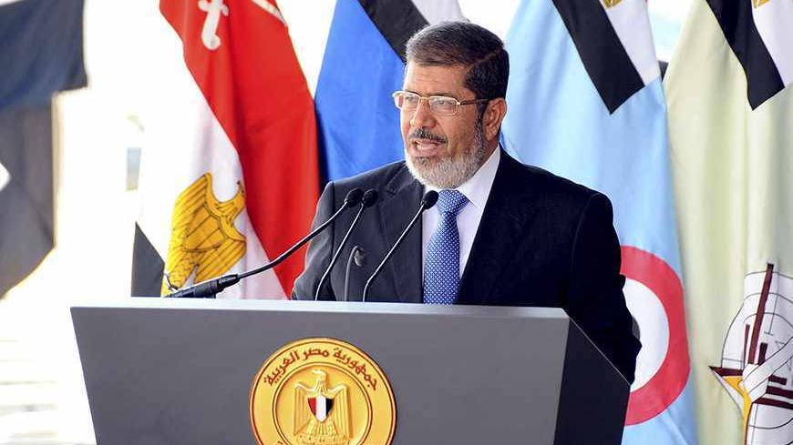 Egypt's President Mohamed Mursi speaks during his visit to the 6th armored division of the second army, in Ismailia October 10, 2012.     REUTERS/Egyptian Presidency/Handout    (EGYPT - Tags: POLITICS MILITARY) FOR EDITORIAL USE ONLY. NOT FOR SALE FOR MARKETING OR ADVERTISING CAMPAIGNS. THIS IMAGE HAS BEEN SUPPLIED BY A THIRD PARTY. IT IS DISTRIBUTED, EXACTLY AS RECEIVED BY REUTERS, AS A SERVICE TO CLIENTS - RTR38ZZ1