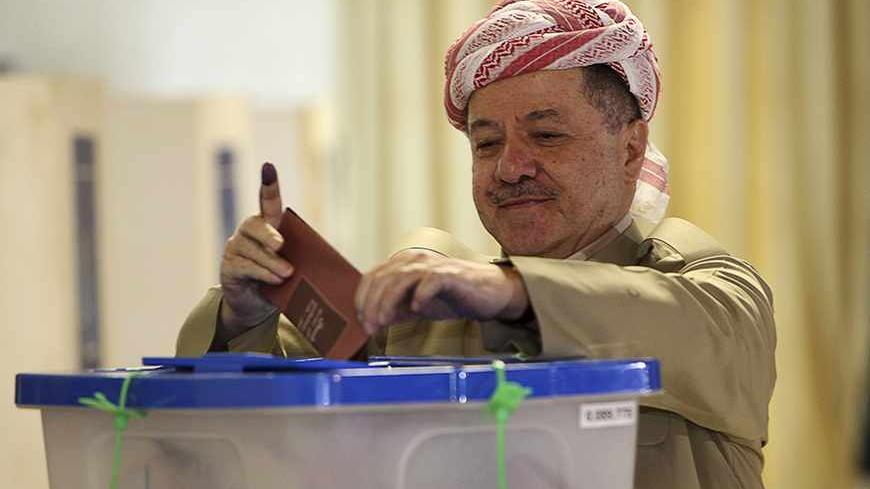 Iraq's Kurdistan President Masoud Barzani votes at a polling station in Arbil, capital of the autonomous Kurdistan region, about 350 km (217 miles) north of Baghdad September 21, 2013. Kurds went to the polls on Saturday to elect a new parliament in an election that is being dubbed as the most crucial in the history of Iraqi Kurdish political powers, with potential to change the political structure of the next parliament and government cabinet.About 1,129 candidates representing 32 political entities are co