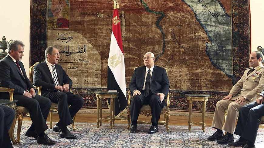 Egypt's interim President Adly Mansour (C), General Abdel Fattah al-Sisi (2nd R) and Foreign Minister Nabil Fahmy (R) meet with Russia's Foreign Minister Sergei Lavrov (2nd L) and Defence Minister Sergei Shoigu (L) at El-Thadiya presidential palace in Cairo, November 14, 2013. Sisi hailed a new era of defence cooperation with Russia on Thursday during a visit by Russian officials, signalling Egyptian efforts to revive ties with an old ally and send a message to Washington after it suspended military aid. RE