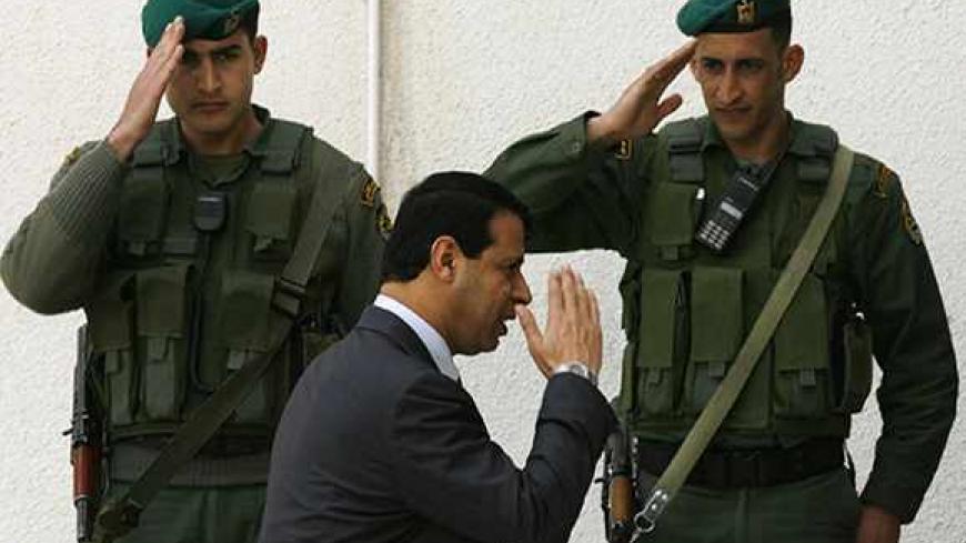 Palestinian security adviser Mohammad Dahlan arrives at the Palestinian Authority headquarters in the West Bank city of Ramallah March 25, 2007. REUTERS/Eliana Aponte (WEST BANK) - RTR1NWDI