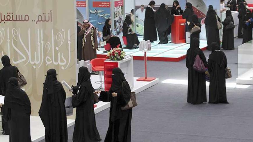 Saudi Arabian women, seeking a job, stand in line to talk with recruiters during a job fair in Riyadh January 25, 2012. It is Women's Day at the first of a series of job fairs launched by the Saudi government this year to find employment for its citizens. In coming months the scheme aims to arrange interviews for 15,000 men and women out of 100,000 applicants, holding similar fairs in the cities of Jeddah and Dammam. Picture taken January 25, 2012. To match Mideast Money SAUDI-ECONOMY/REFORMS      REUTERS/ 