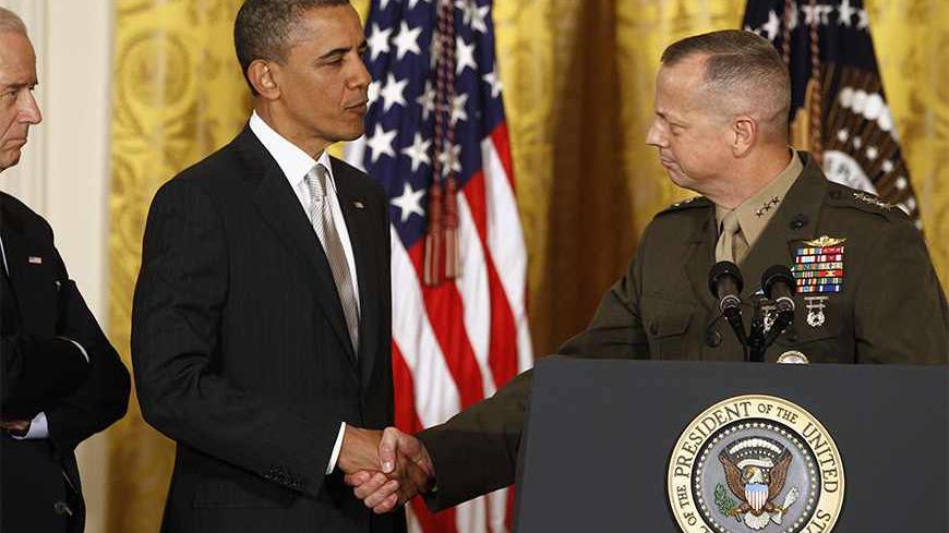 U.S. Marine Lt. Gen. John Allen shakes hands with U.S. President Barack Obama at an event in the East Room of the White House in this April 28, 2011 file photo during Obama's announcement that then CIA Director Leon Panetta would be nominated as Secretary of Defense. Former CIA Director David Petraeus will testify November 16, 2012 on Capitol Hill about the recent attack on the U.S. diplomatic mission in Benghazi, Libya, but is also expected to be asked about his resignation last week over an extramarital a