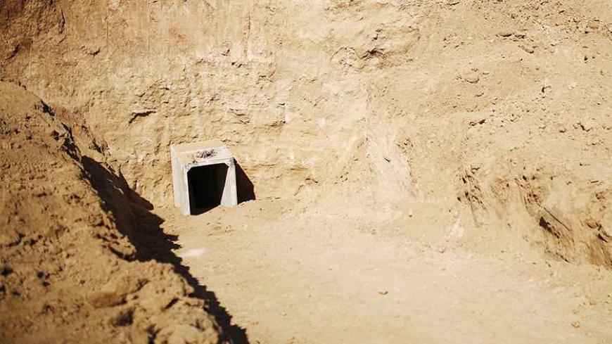 An entrance to a tunnel exposed by the Israeli military is seen near Kibbutz Ein Hashlosha, just outside the southern Gaza Strip October 13, 2013. Israel displayed on Sunday what it called a Palestinian "terror tunnel" running into its territory from the Gaza Strip and said it was subsequently freezing the transfer of building material to the enclave. REUTERS/Amir Cohen (ISRAEL - Tags: POLITICS CIVIL UNREST MILITARY) - RTX149RZ
