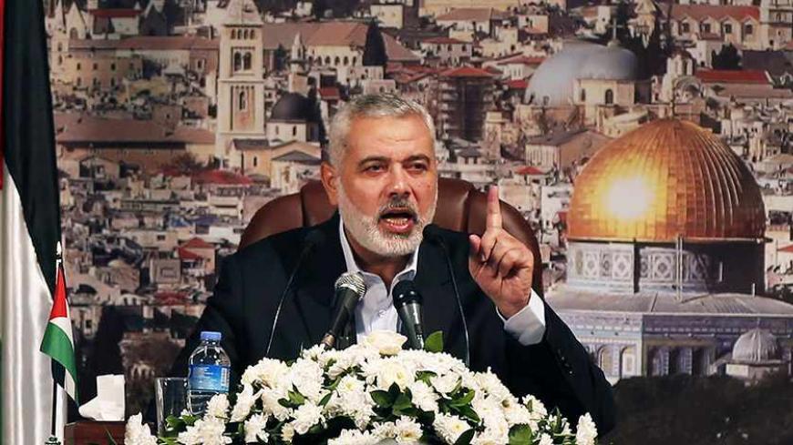 Ismail Haniyeh, prime minister of the Hamas Gaza government, gestures as he delivers a speech in Gaza City October 19, 2013. Haniyeh urged rival Palestinian President Mahmoud Abbas to speed up the implementation of the faltering Egyptian-brokered unity deal to heal six years of political rifts. REUTERS/Mohammed Salem (GAZA - Tags: POLITICS) - RTX14GMX