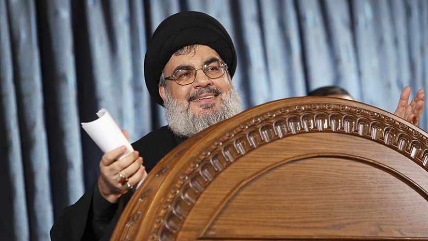 Lebanon's Hezbollah leader Sayyed Hassan Nasrallah makes a rare public appearance as he addresses his supporters during a religious ceremony on the eve of Ashura in Beirut's southern suburbs November 13, 2013. REUTERS/Hasan Shaaban (LEBANON - Tags: POLITICS) - RTX15C62