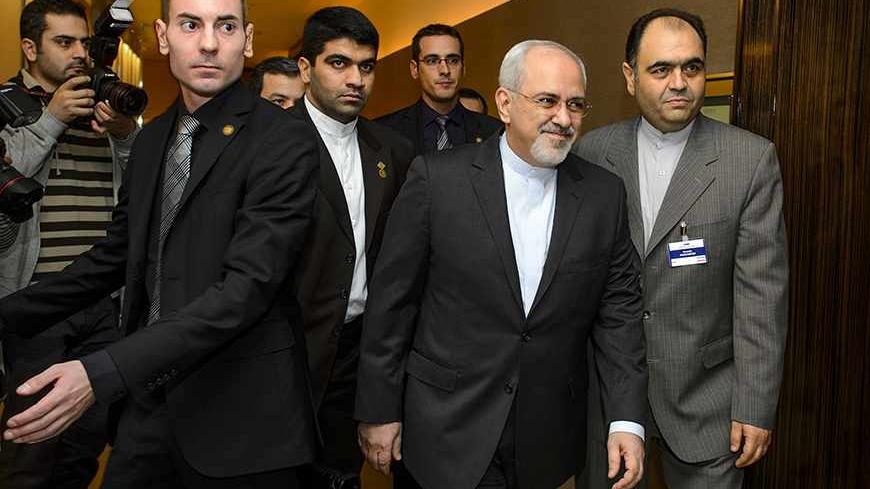 Iranian Foreign Minister Mohammad Javad Zarif (2nd R) arrives for talks over Iran's nuclear programme in Geneva November 22, 2013. REUTERS/Fabrice Coffrini/Pool (SWITZERLAND - Tags: POLITICS ENERGY) - RTX15OC8
