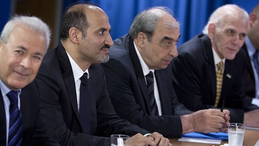 President of Syrian Opposition Coalition Ahmed Asi Al-Jerba (2nd L), along with members of the Syrian Opposition Coalition Dr. Burhan Ghalioun (L), Michel Kilo (3rd L) and Samir Shishakli (R) meet with U.S. Secretary of State John Kerry (not pictured) at the United States Mission to the United Nations in New York, July 25, 2013.    REUTERS/Carlo Allegri  (UNITED STATES - Tags: POLITICS) - RTX11Z6N