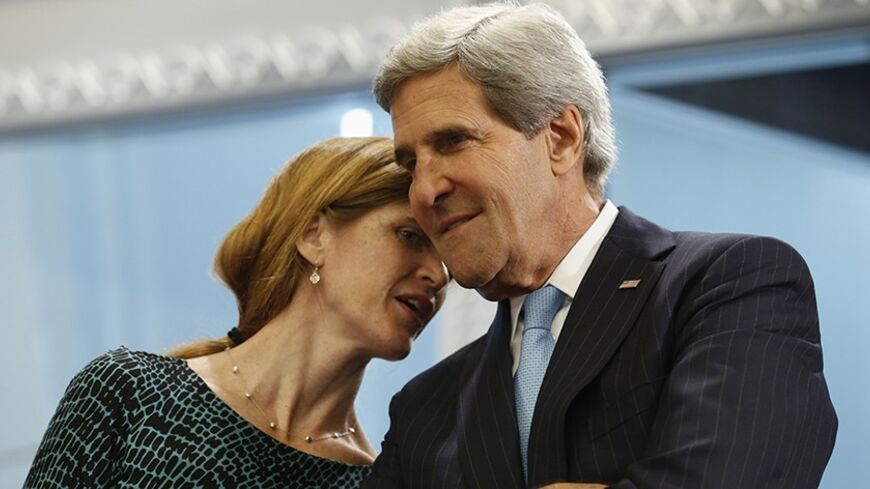 U.S. ambassador to the United Nations Samantha Power whispers to U.S. Secretary of State John Kerry (R) during a meeting between U.S. President Barack Obama and Lebanon's President Michel Sleiman (both unseen) at the United Nations General Assembly in New York September 24, 2013.    REUTERS/Kevin Lamarque  (UNITED STATES - Tags: POLITICS) - RTX13XZ2