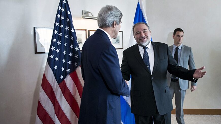Israeli Foreign Minister Avigdor Lieberman (C) greets U.S. Secretary of State John Kerry (L) ahead of their meeting at the David Citadel hotel in Jerusalem January 3, 2014. REUTERS/Brendan Smialowski/Pool (JERUSALEM - Tags: POLITICS) - RTX170LB