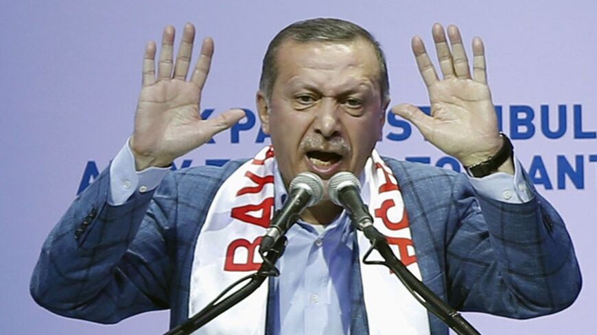 Turkey's Prime Minister Tayyip Erdogan gestures as he addresses supporters during a party meeting to announce AK Party candidates for the upcoming local elections, in Istanbul January 26, 2014. REUTERS/Murad Sezer (TURKEY - Tags: POLITICS) - RTX17VM8