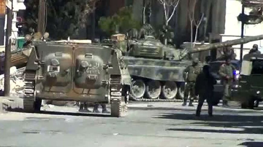 An image grab from a video uploaded on YouTube shows Syrian army tanks in the city of Yabrud, 80 km north of Damascus  on March 8, 2012. 
== RESTRICTED TO EDITORIAL USE - MANDATORY CREDIT "AFP PHOTO / YOUTUBE" - NO MARKETING NO ADVERTISING CAMPAIGNS - DISTRIBUTED AS A SERVICE TO CLIENTS - AFP IS USING PICTURES FROM ALTERNATIVE SOURCES AS IT WAS NOT AUTHORISED TO COVER THIS EVENT, THEREFORE IT IS NOT RESPONSIBLE FOR ANY DIGITAL ALTERATIONS TO THE PICTURE'S EDITORIAL CONTENT, DATE AND LOCATION WHICH CANNOT BE