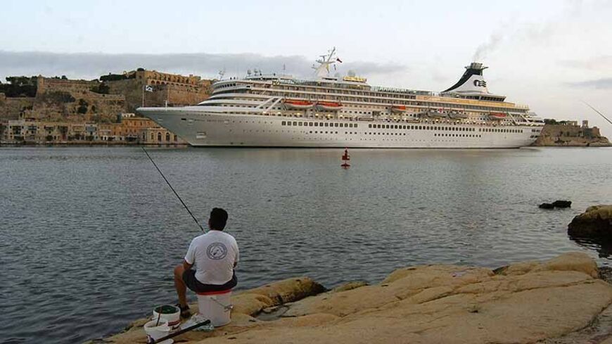 TO GO WITH AFP STORY BY JEAN-FRANCOIS LE MOUNIER - (FILES) - A Cruise liner enters the Grand Harbour in Valletta, the capital city of Malta, 05 October 2002. Malta enters the EU's border-free Schengen zone, 21 December 2007, a change many hope will boost tourism to the tiny Mediterranean state. Joining the Schengen zone along with eight other countries, Malta will become the first independent island state of Europe without border controls of the 22 Schengen zone countries. AFP PHOTO / BEN BORG CARDONA (Phot