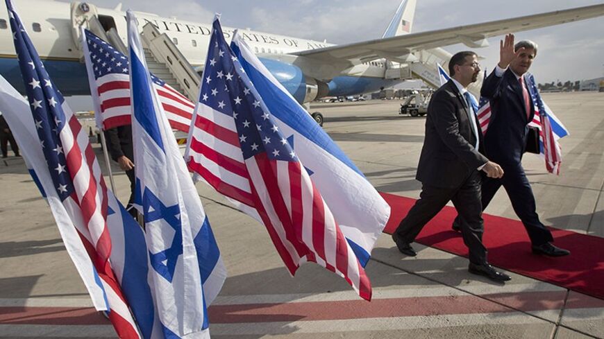 U.S. Secretary of State John Kerry is greeted by U.S. Ambassador to Israel Dan Shapiro (L) as he arrives in Tel Aviv November 8, 2013. Kerry met privately with Israeli Prime Minister Benjamin Netanyahu on Friday before joining nuclear talks between major powers and Iran in Geneva.    REUTERS/Jason Reed   (ISRAEL - Tags: POLITICS) - RTX154Z7