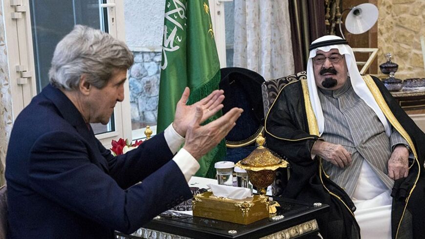U.S. Secretary of State John Kerry (L) and Saudi Arabia's King Abdullah bin Abdulaziz al-Saud talk before a meeting at the King's desert encampment in Rawdat al-Khuraim January 5, 2014. REUTERS/Brendan Smialowski/Pool (SAUDI ARABIA - Tags: POLITICS ROYALS) - RTX172WK