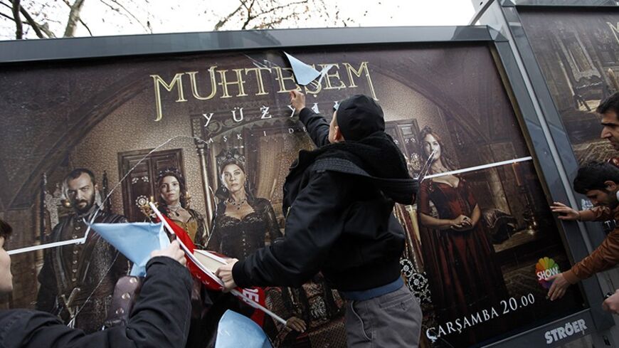 Demonstrators throw eggs and attack billboards advertising the TV series "The Magnificent Century" during a protest near the Show TV headquarters in Istanbul January 9, 2011. A steamy television period drama about a 16th century sultan has angered conservative Muslims in Turkey and sparked a debate over the portrayal of the past in a country rediscovering its Ottoman heritage. "The Magnificent Century" chronicles the life of Suleiman the Magnificent, who ruled the Ottoman Empire during its golden age, showi