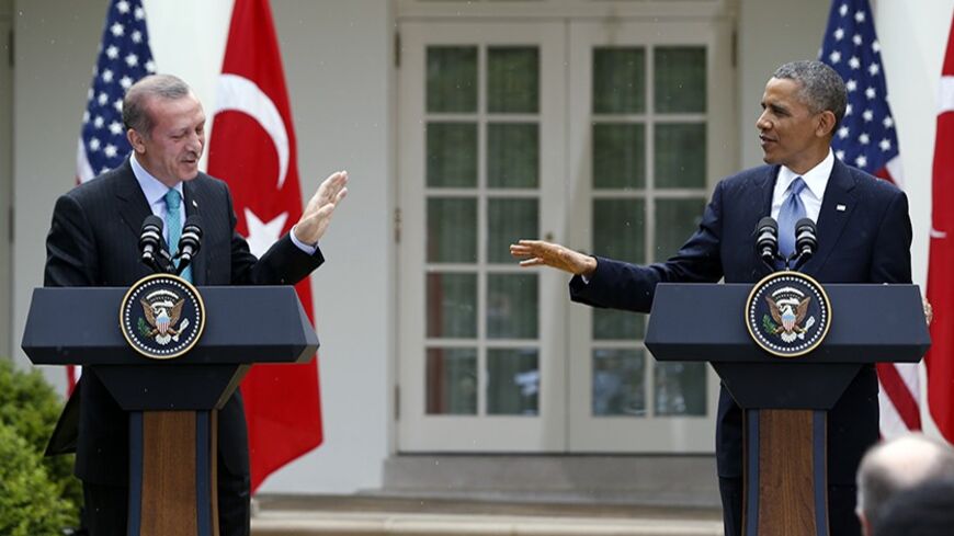 U.S. President Barack Obama (R) and Turkish Prime Minister Recep Tayyip Erdogan hold a joint news conference in the White House Rose Garden in Washington, May 16, 2013. REUTERS/Jason Reed (UNITED STATES  - Tags: POLITICS)   - RTXZPC4