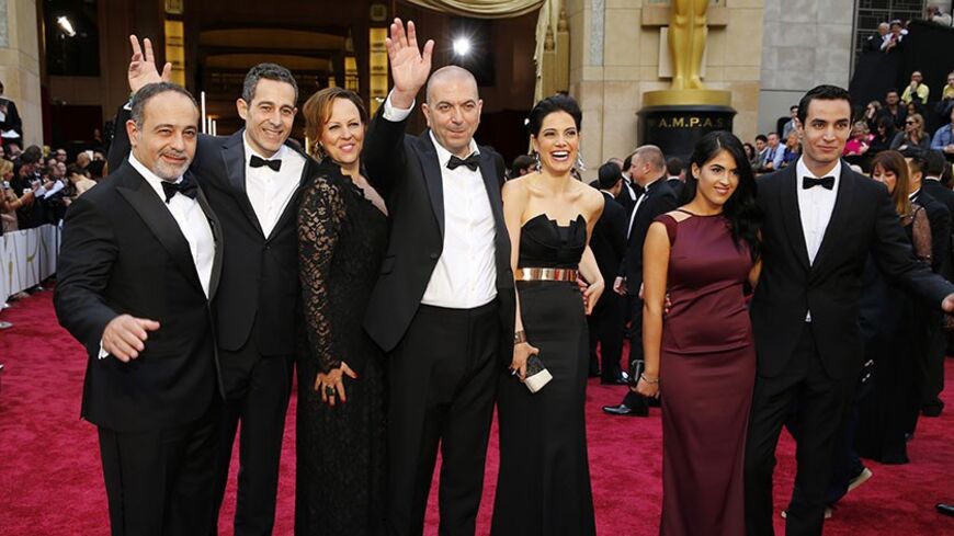 Hany Abu-Assad (C), Director Palestinian film "Omar" arrives with his cast at the 86th Academy Awards in Hollywood, California March 2, 2014.  REUTERS/Mike Blake (UNITED STATES TAGS: ENTERTAINMENT) (OSCARS-ARRIVALS)

 - RTR3FXFE