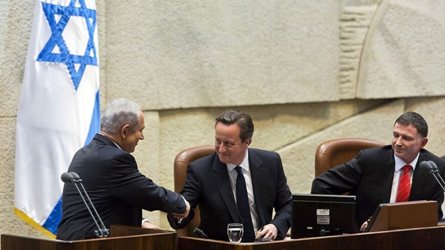 British Prime Minister David Cameron (C) shakes hands with Israel's Prime Minister Benjamin Netanyahu as Knesset Speaker Yuli Edelstein (R) looks on, at the Knesset, Israel's parliament, in Jerusalem March 12, 2014. Cameron denounced Iran's government as a "despotic regime" in a speech to Israel's parliament on Wednesday and accused Tehran of making "despicable" efforts to arm Palestinian militants. REUTERS/Jim Hollander/Pool (JERUSALEM - Tags: POLITICS) - RTR3GSKY