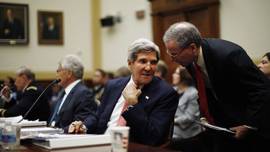 U.S. Secretary of State John Kerry confers with U.S. Ambassador to Syria, Robert Ford (R) as Kerry testifies at a U.S. House Foreign Affairs Committee hearing on Syria on Capitol Hill in Washington, September 4, 2013.   REUTERS/Jason Reed     (UNITED STATES - Tags: POLITICS) - RTX137DD