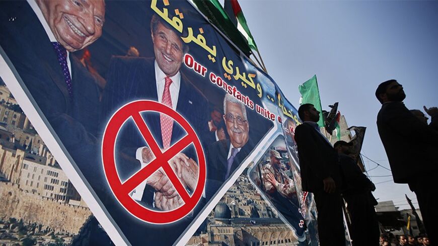 Palestinians take part in a protest against peace talks with Israel, in the northern Gaza Strip February 7, 2014. REUTERS/Mohammed Salem (GAZA - Tags: POLITICS CIVIL UNREST) - RTX18CAI