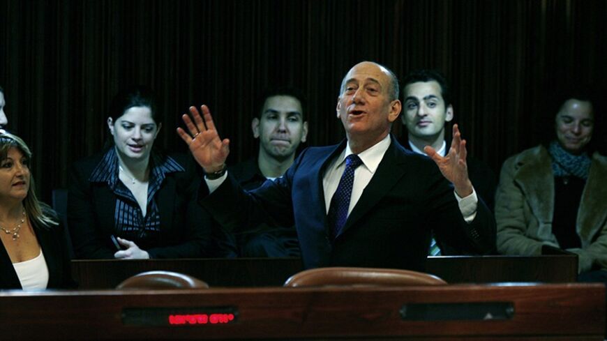 Israel's Prime Minister Ehud Olmert stands with Shula Zaken (L), an administrator in his office, during a session of the Knesset, the Israeli Parliament, in Jerusalem January 2, 2008.  REUTERS/Ronen Zvulun (JERUSALEM) - RTX55O4
