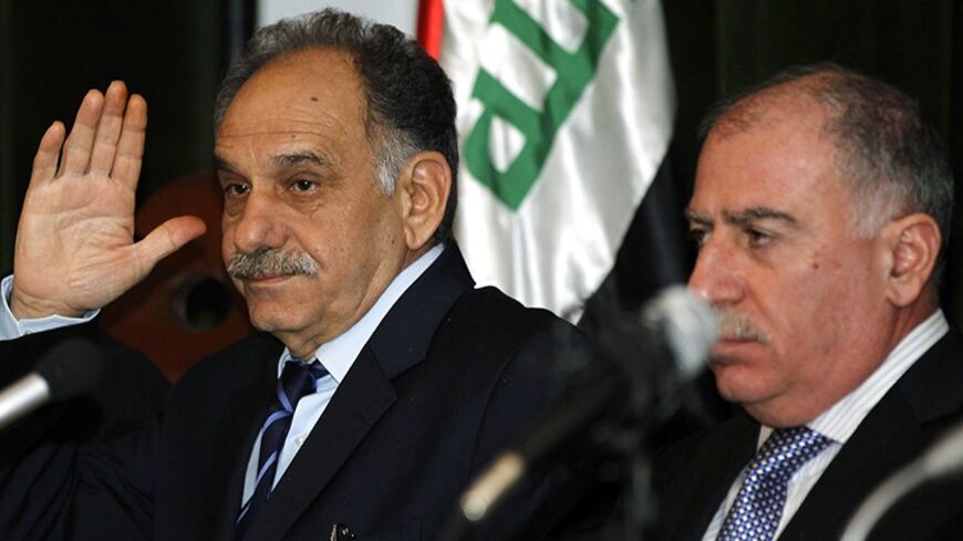 Iraqi Sunni Deputy Prime Minister Saleh al-Mutlaq (L) and Iraqiya Sunni speaker of parliament Osama al-Nujaifi hold a news conference for the seniors of Iraqiya bloc in Baghdad January 18, 2012.  REUTERS/Mohammed Ameen (IRAQ - Tags: POLITICS) - RTR2WGNT