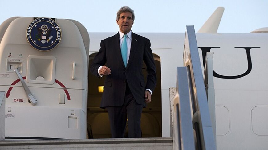 U.S. Secretary of State John Kerry disembarks from his plane upon  his arrival at Ben Gurion International airport near Tel Aviv March 31, 2014. Kerry broke from his travel schedule for the second time in a week to rush back to the Middle East on Monday to try to salvage Israeli-Palestinian peace talks. REUTERS/Jacquelyn Martin/Pool (ISRAEL - Tags: POLITICS) - RTR3JD3D