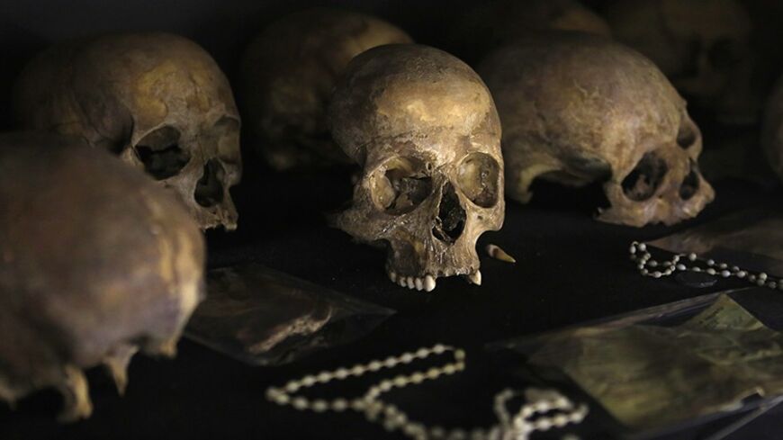 Preserved human skulls are seen on display at the Kigali Genocide Memorial Centre, as the country prepares to commemorate the twentieth anniversary of the 1994 genocide in the Rwandan capital Kigali April 5, 2014. An estimated 800,000 people were killed in 100 days during this genocide.  REUTERS/Noor Khamis (RWANDA - Tags: ANNIVERSARY CIVIL UNREST POLITICS) - RTR3K1VK