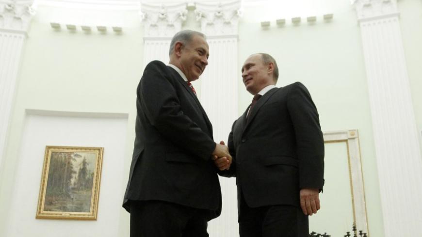 Russian President Vladimir Putin (R) shakes hands with Israel's Prime Minister Benjamin Netanyahu during their meeting in Moscow's Kremlin November 20, 2013. REUTERS/Maxim Shemetov (RUSSIA - Tags: POLITICS) - RTX15LV1