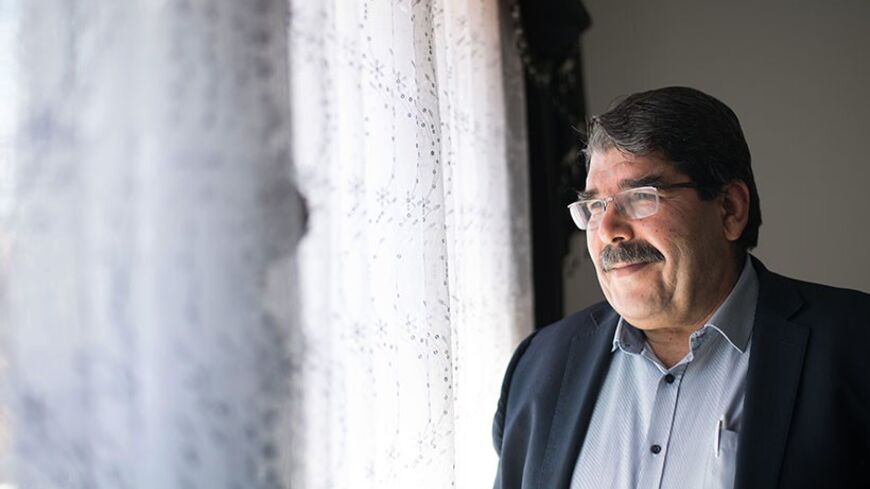 Salih Muslim, co-president of the Syrian Kurdish Democratic Union Party (PYD), poses during an interview in Marseille, southern France, on December 1, 2013. PYD, the biggest Kurdish armed group, wants to establish an autonomous Kurdish state within a federal Syria and a commission is already writing the constitution of this potential state, Muslim told AFP. Syrian Kurds in the war-torn country's northeast announced last month the formation of a transitional autonomous administration after making key territo