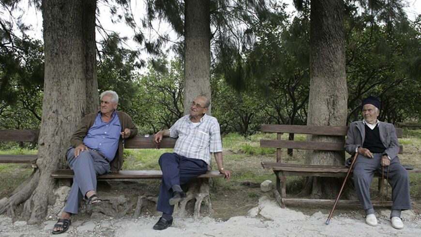 Men rest in Vakifli village, which is located in Hatay province, June 13, 2007. In sleepy Vakifli, Turkey's last surviving ethnic Armenian village, perched high among orange groves overlooking the east Mediterranean, elderly farmers say they will probably vote for the Islamist-rooted AK Party in July 22 elections. Picture taken June 13, 2006. To match feature TURKEY-ELECTION/CHRISTIANS   REUTERS/Umit Bektas (TURKEY) - RTR1QYGY