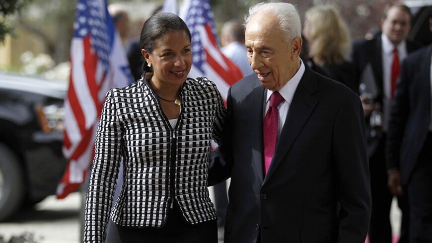 U.S. National Security Adviser Susan Rice (L) and Israel's President Shimon Peres speak before their meeting in Jerusalem May 7, 2014. REUTERS/Ammar Awad (JERUSALEM - Tags: POLITICS) - RTR3O62A