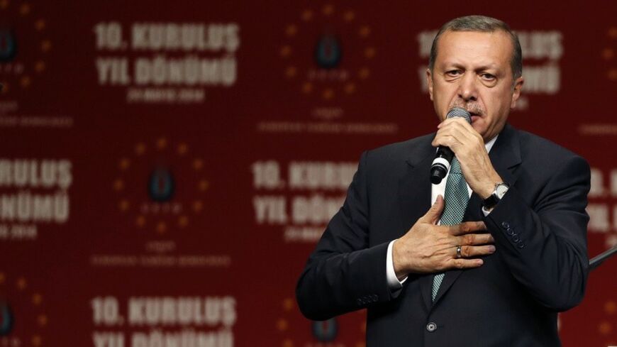 Turkish Prime Minister Tayyip Erdogan speaks to supporters during his visit in Cologne May 24, 2014.       REUTERS/Wolfgang Rattay (GERMANY  - Tags: POLITICS CIVIL UNREST)   - RTR3QNX8