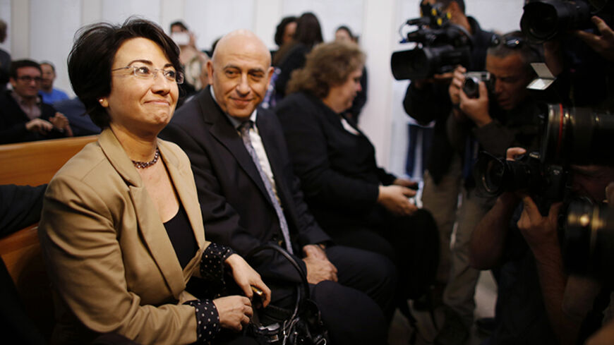 Israeli Arab lawmaker Haneen Zoabi (L) waits before a hearing at the Supreme Court in Jerusalem December 27, 2012. Zoabi appealed to the Supreme Court after Israel's electoral authority barred her from re-election on December 19, saying she had supported the nation's enemies by joining a protest ship that tried to break a naval blockade of Gaza. REUTERS/Ammar Awad (JERUSALEM - Tags: POLITICS) - RTR3BXBA
