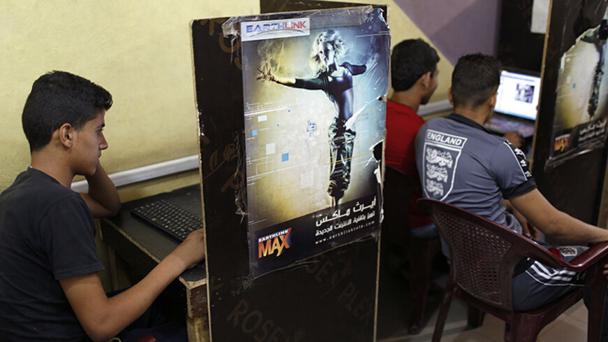 Iraqi Shi'ite youths use computers at an internet cafe in Sadr City in Baghdad May 3, 2014. Iraq is now gripped by its worst violence since the heights of its 2005-2008 sectarian war, and Sunni Islamist insurgents who target Shi'ites have been regaining ground in the country over the past year. But despite the instability, daily life continues in poor Shi'ite neighbourhoods of Baghdad such as Al-Fdhiliya and Sadr City - a sprawling slum marred by poor infrastructure and overcrowding. Picture taken May 3, 20