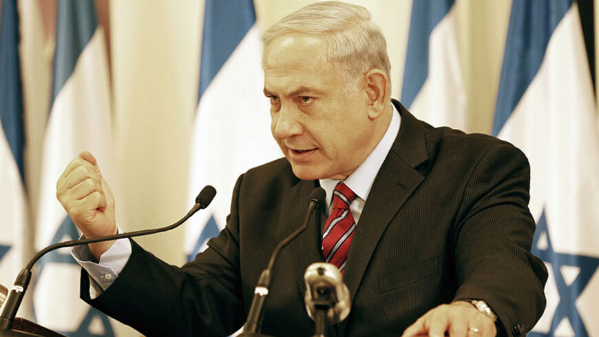 Israel's Prime Minister Benjamin Netanyahu gestures during a news conference in Tel Aviv June 15, 2014. Israel said on Sunday Hamas militants had abducted three Israeli teenagers in the occupied West Bank, warning of "serious consequences" as it pressed on with a search and detained dozens of Palestinians. REUTERS/Finbarr O'Reilly (ISRAEL - Tags: POLITICS CIVIL UNREST) - RTR3TVSJ