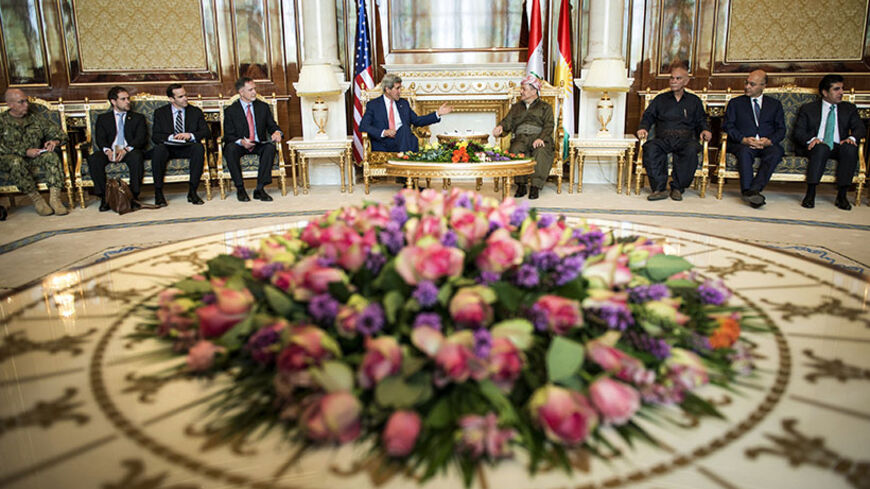 Kurdistan Regional Government President Massoud Barzani (centre, R) meets with U.S. Secretary of State John Kerry (centre, L) at the presidential palace in Arbil, the capital of northern Iraq's Kurdistan autonomous region, June 24, 2014. Kerry was in Iraqi Kurdistan on Tuesday to urge its leaders not to withdraw from the political process in Baghdad after their forces took control of the northern oil city of Kirkuk. Peshmerga fighters, the security forces of Iraq's autonomous Kurdish north, seized control o
