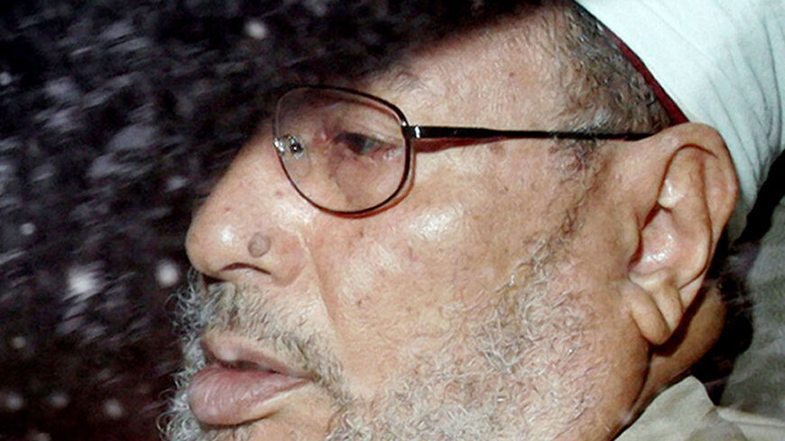 Egyptian-born Muslim cleric Yusuf Al-Qaradawi arrives at the London Central Mosque, July 9, 2004. Leading Muslim theologian Qaradawi, who condemned the September 11 attacks and the Bali bomb but condones some suicide bombings, will have all his speeches monitored whilst he is in Britain, Britain's Home Secretary David Blunkett said on July 7. REUTERS/Peter Macdiarmid  PKM/ASA/WS - RTR67I1
