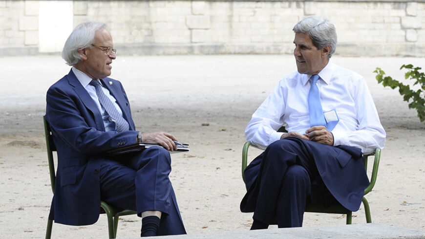 U.S. Secretary of State John Kerry (R) and U.S. Special Envoy for Israeli-Palestinian negotiations Martin Indyk talk in Les Tuilleries in Paris September 8, 2013.  REUTERS/Susan Walsh/Pool (FRANCE - Tags: POLITICS) - RTX13CU4