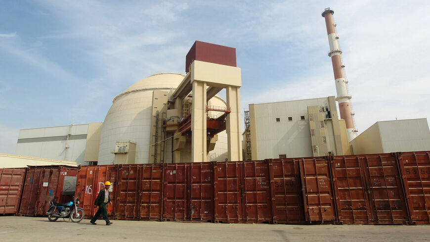 A Russian worker walks past the Bushehr nuclear power plant, 1,200 km (746 miles) south of Tehran October 26, 2010. Iran has begun loading fuel into the core of its first nuclear power plant on Tuesday, one of the last steps to realising its stated goal of becoming a peaceful nuclear power, state-run Press TV reported on Tuesday. REUTERS/Mehr News Agency/Majid Asgaripour (IRAN - Tags: POLITICS ENERGY IMAGES OF THE DAY) - RTXTUI0